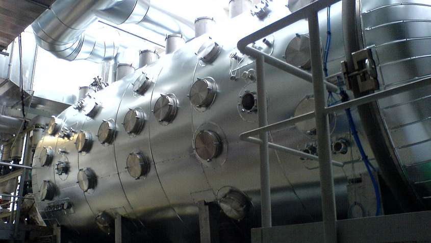 A very complex metal construc with many valves and  pipes