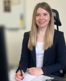 Lisa working at her desk