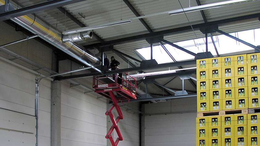 A man during the maintenance of air ducts