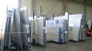 Various white cladding panels in a warehouse