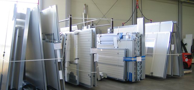 Various white cladding panels in a warehouse