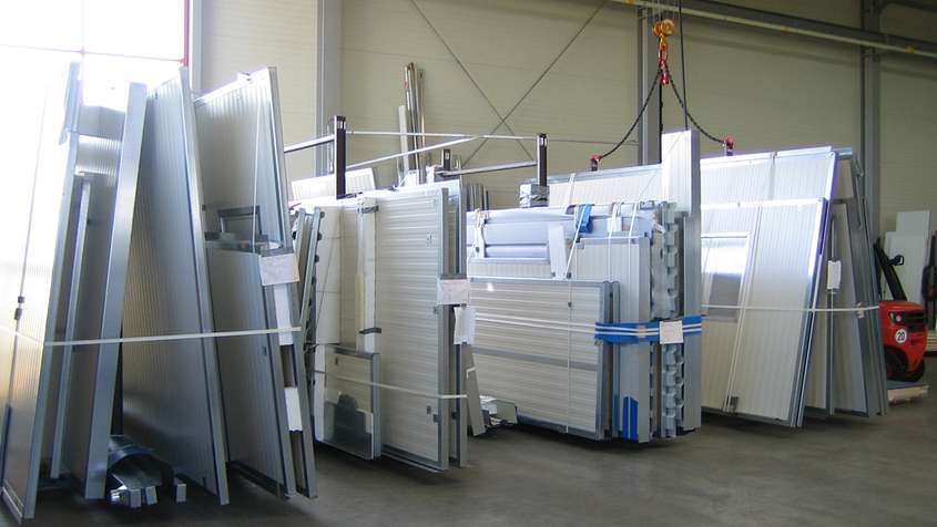 Various white cladding panels in a warehouse