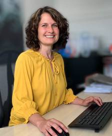 Monika Fischer while working at her desk