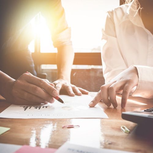 Two people working on a document